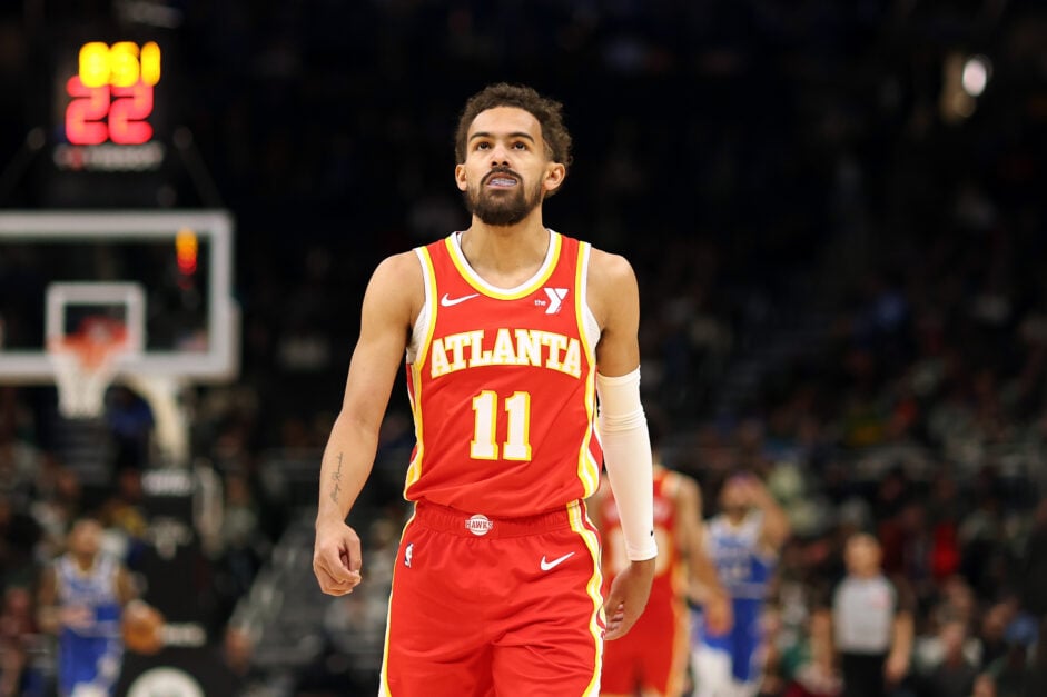 Trae Young #11 of the Atlanta Hawks walks backcourt during a game against the Milwaukee Bucks at Fiserv Forum on December 04, 2024 in Milwaukee, Wisconsin.