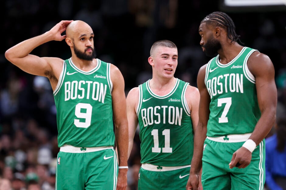 Derrick White #9 of the Boston Celtics, Payton Pritchard #11 of the Boston Celtics, Jaylen Brown #7 of the Boston Celtics react