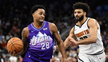 Brice Sensabaugh #28 of the Utah Jazz drives past Jamal Murray #27 of the Denver Nuggets