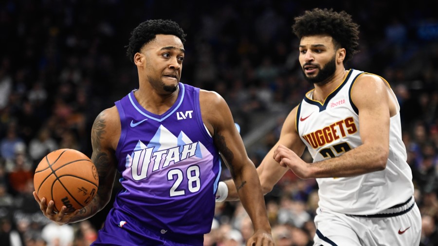 Brice Sensabaugh #28 of the Utah Jazz drives past Jamal Murray #27 of the Denver Nuggets