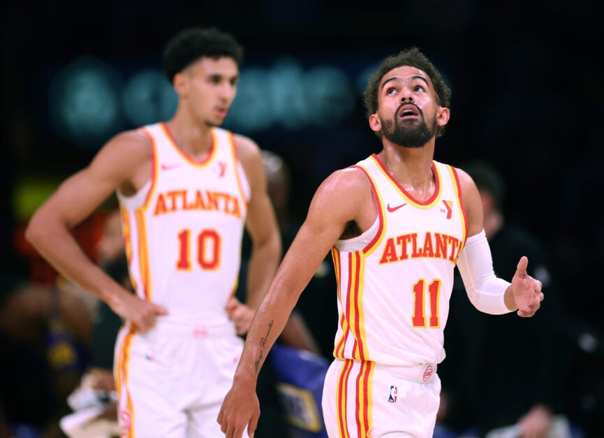 Trae Young #11 and Trae Young #11 of the Atlanta Hawks react during a 119-102 loss to the Los Angeles Lakers at Crypto.com Arena on January 03, 2025 in Los Angeles, California.