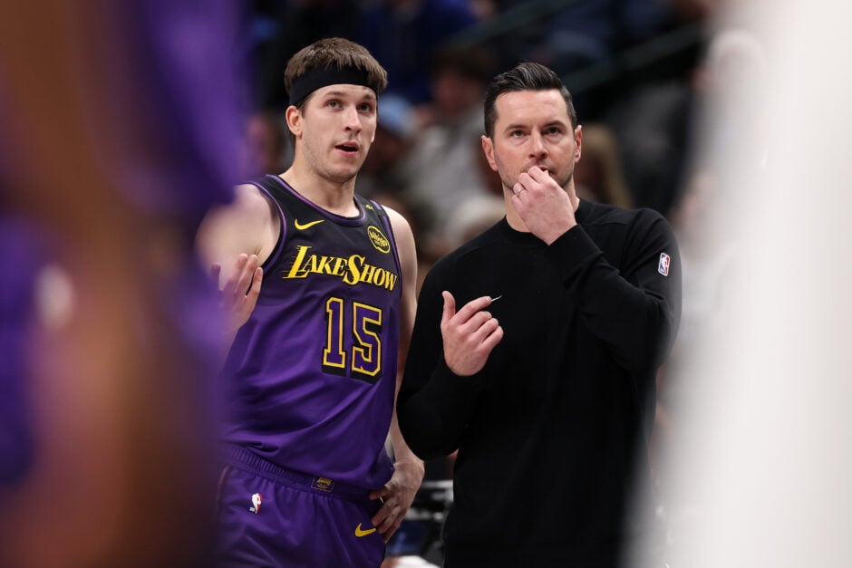 Austin Reaves talks to Los Angeles Lakers head coach JJ Redick during a game against the Dallas Mavericks
