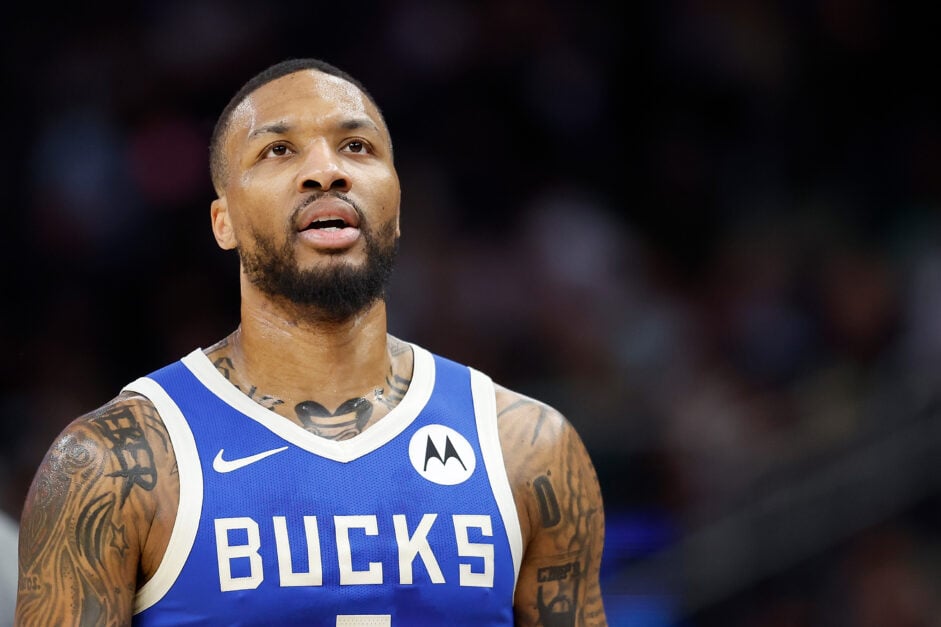 Damian Lillard #0 of the Milwaukee Bucks walks to the bench during the first half of the game against the Toronto Raptors.
