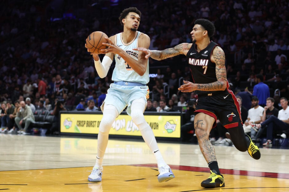 San Antonio Spurs center Victor Wembanyama handles the ball against Miami Heat center Kel'el Ware