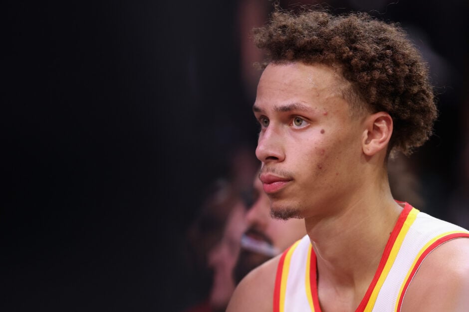 Dyson Daniels #5 of the Atlanta Hawks on the bench during the first half of an NBA game.