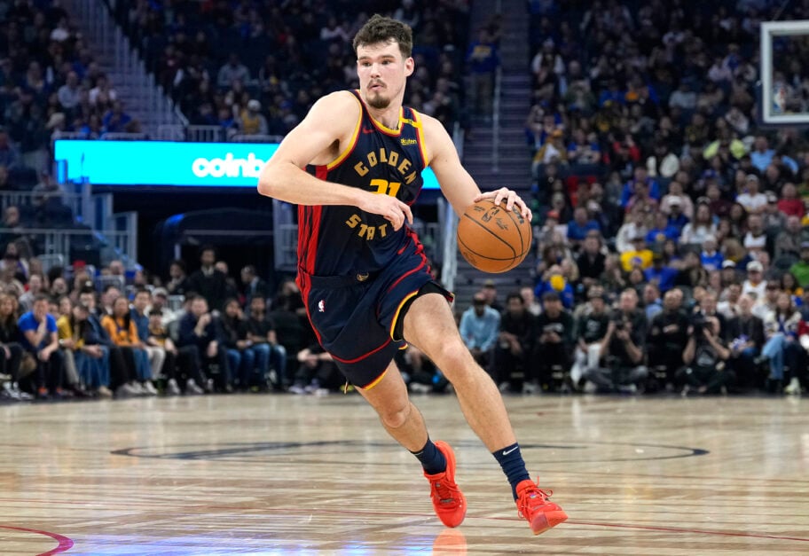 Quinten Post #21 of the Golden State Warriors drives to the basket