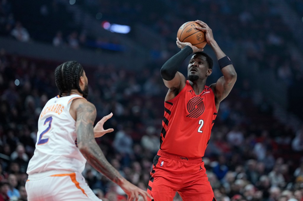 A Portland Trail Blazers player shoots a basketball.