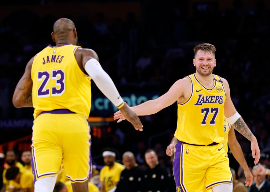 Luka Doncic #77 of the Los Angeles Lakers reacts to LeBron James #23