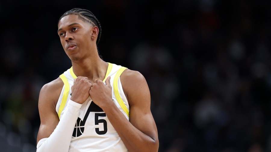 Cody Williams #5 of the Utah Jazz reacts against the Washington Wizards...