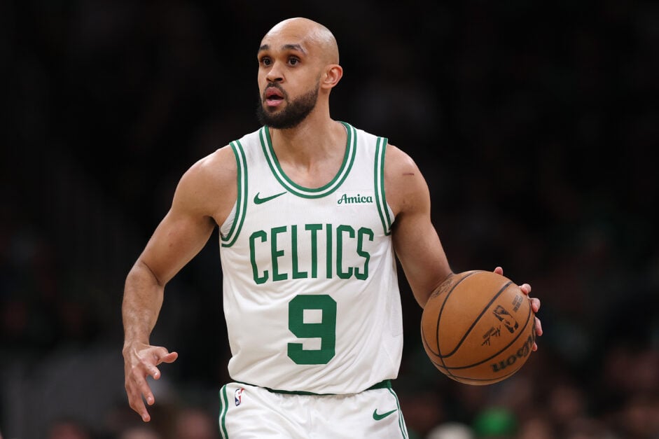 Boston Celtics point guard Derrick Whit dribbles against the Portland Trail Blazers