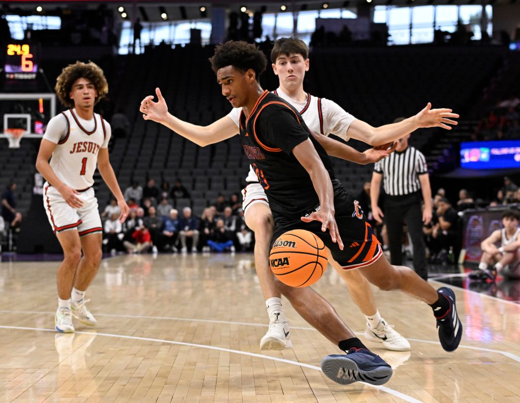 Alijah Arenas #0 of Chatsworth Chancellors drives to the basket against Jesuit Marauders in the first half of a boys CIF State Division II championship basketball game at the Golden 1 Center in Sacramento on Saturday, March 15, 2025. 