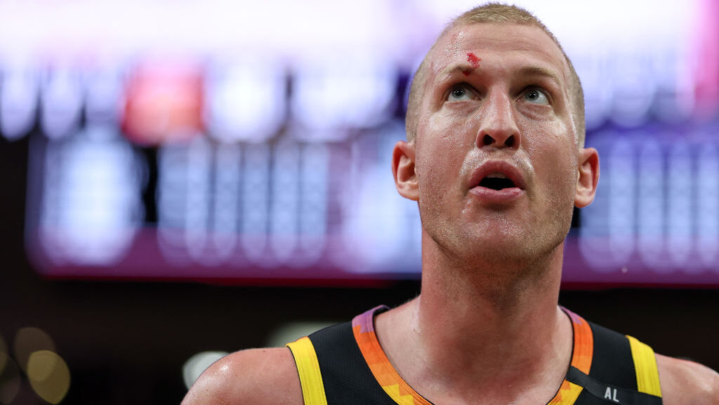 Mason Plumlee #22 of the Phoenix Suns walks off the court after engaging in a scuffle with Steven A...