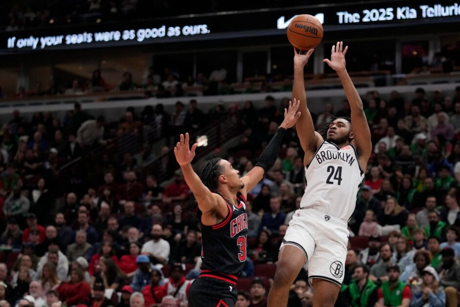 The Brooklyn Nets' elite scorer Cam Thomas shooting over Tre Jones of the Chicago Bulls.
