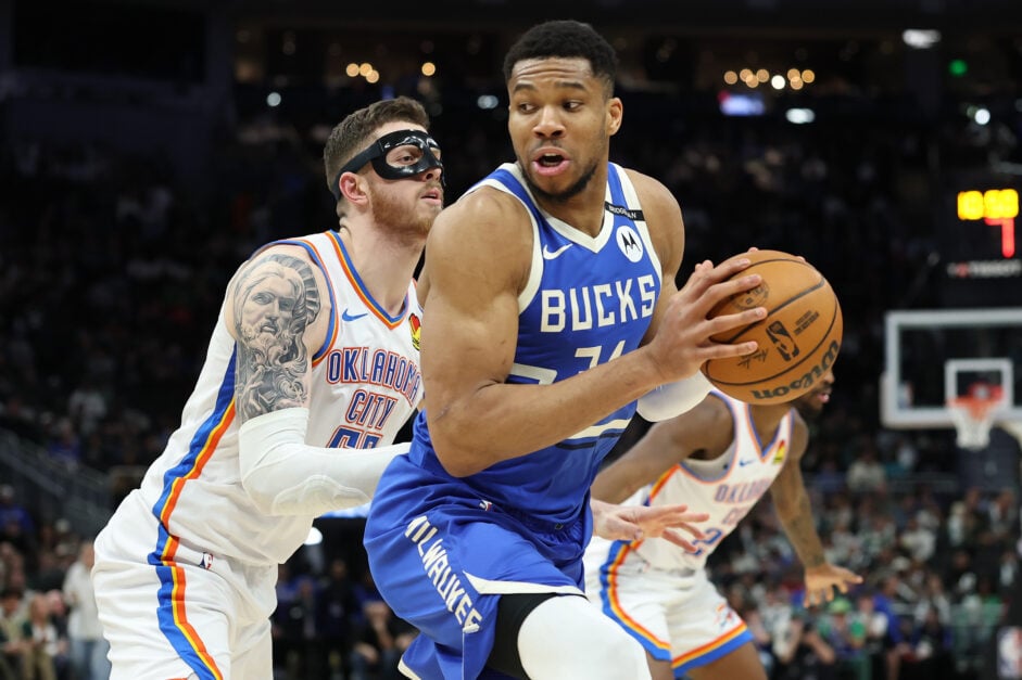 Oklahoma City Thunder center Isaiah Hartenstein guards Giannis Antetokounmpo