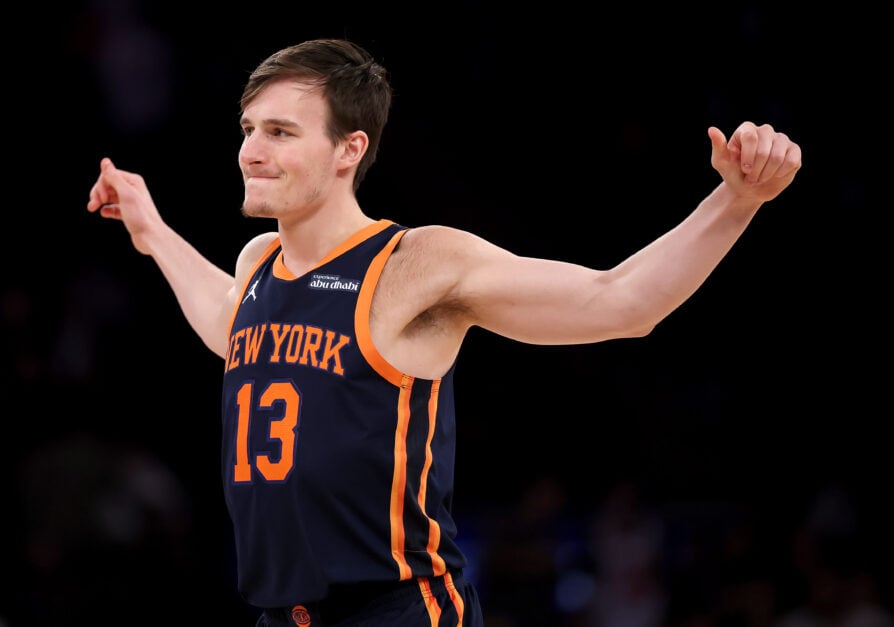 Tyler Kolek #13 of the New York Knicks stretches as he enters the game during the second half against the Miami Heat at Madison Square Garden on March 17, 2025 in New York City. The New York Knicks defeated the Miami Heat 116-95.