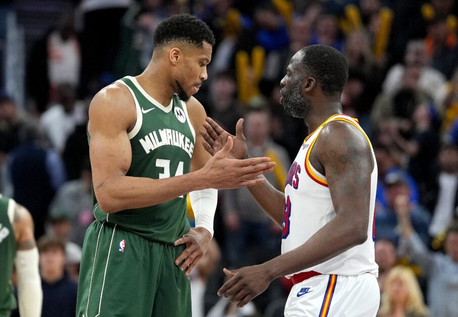 Milwaukee Bucks forward Giannis Antetokounmpo with Golden State Warriors forward Draymond Green