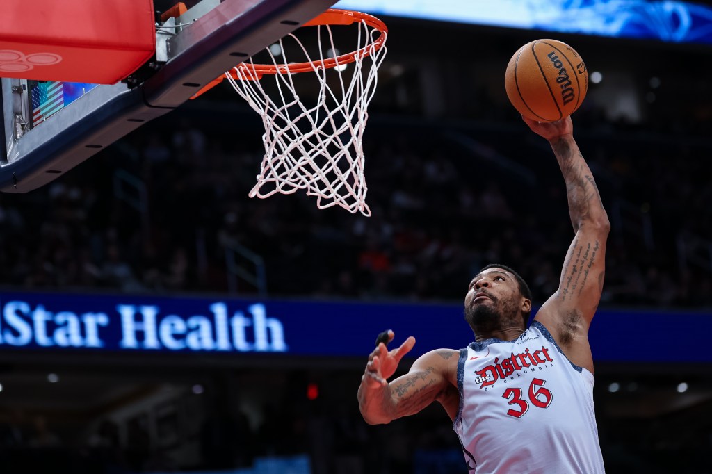 Marcus Smart #36 of the Washington Wizards goes to the basket against the Miami Heat during the first half at Capital One Arena on March 31, 2025 in Washington, DC.