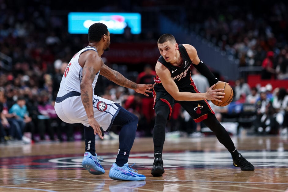 Miami Heat guard Tyler Herro dribbles against Washington Wizards guard Marcus Smart