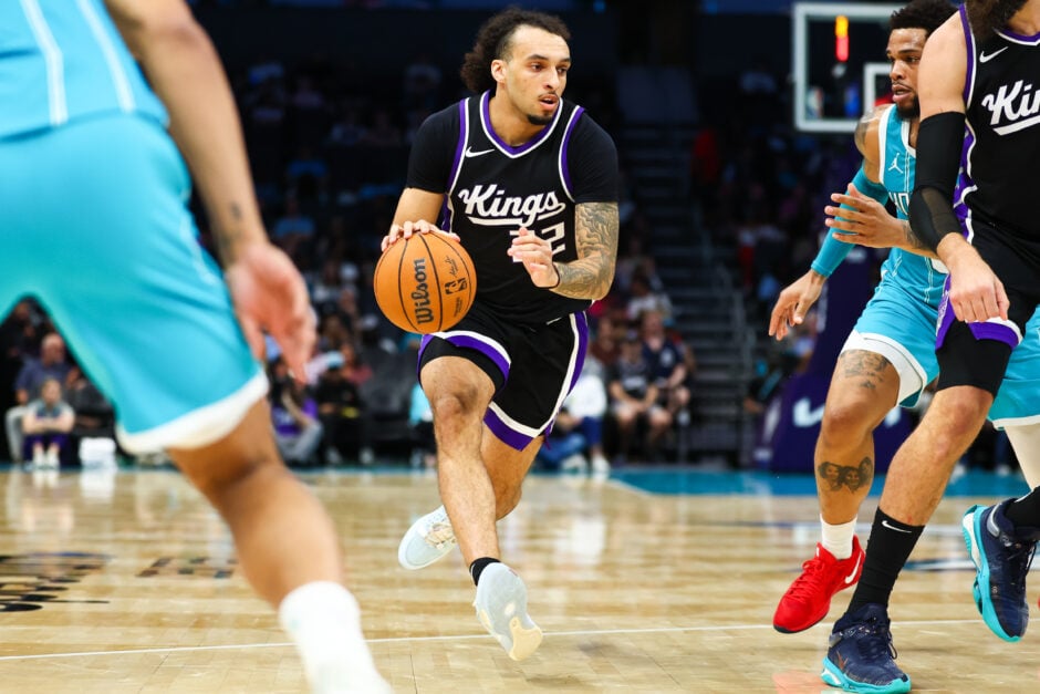 Sacramento Kings guard Devin Carter dribbles against the Charlotte Hornets
