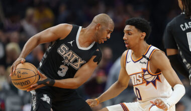 Chris Paul #3 of the San Antonio Spurs handles the ball against Ryan Dunn #0 of the Phoenix Suns du...