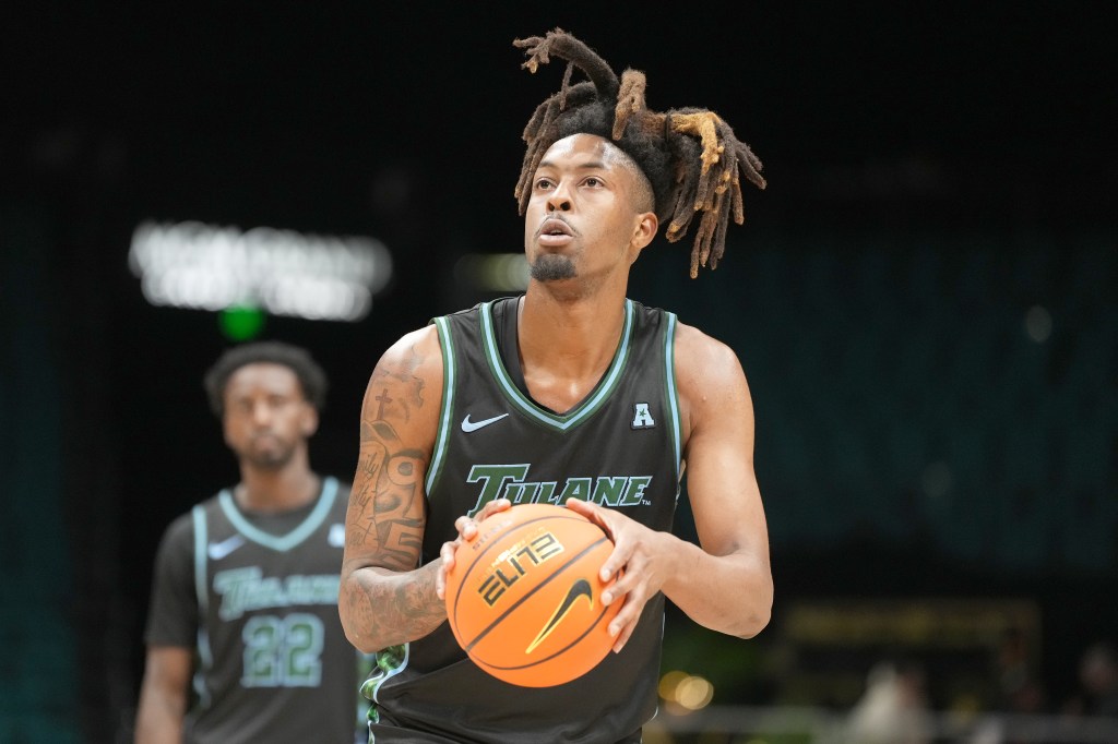 Tulane basketball player dribbling a basketball.