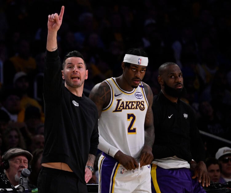 Head coach JJ Redick reacts as Jarred Vanderbilt #2 and LeBron James #23 of the Los Angeles Lakers looks on against the Minnesota Timberwolves.