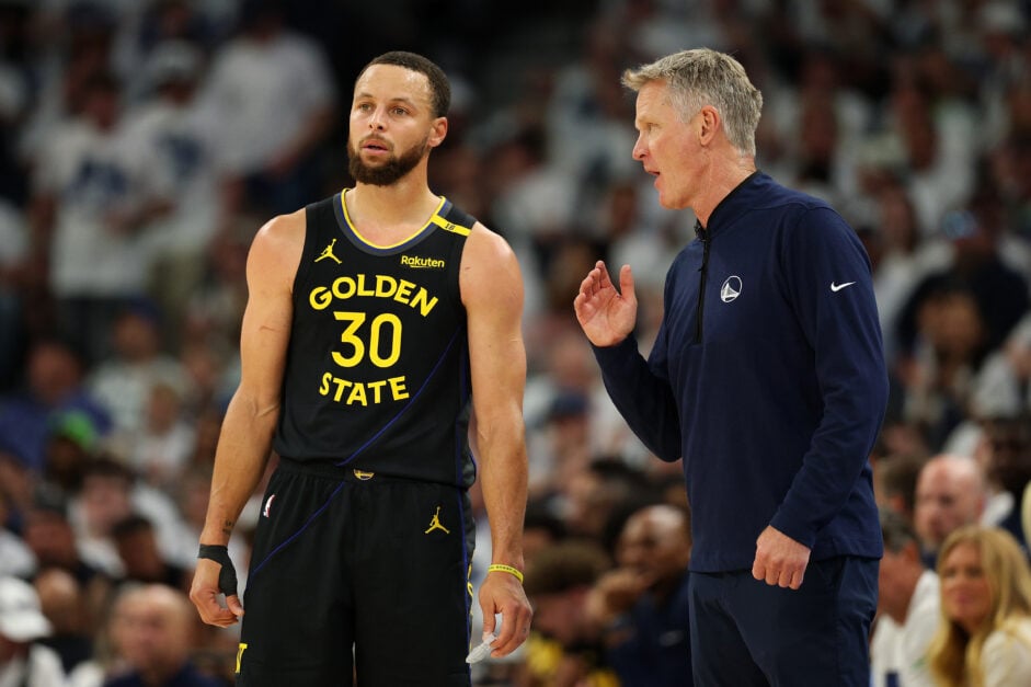 Head coach Steve Kerr talks to Stephen Curry #30 of the Golden State Warriors in the second quarter of Game One against the Minnesota Timberwolves during 2025 NBA Playoffs.