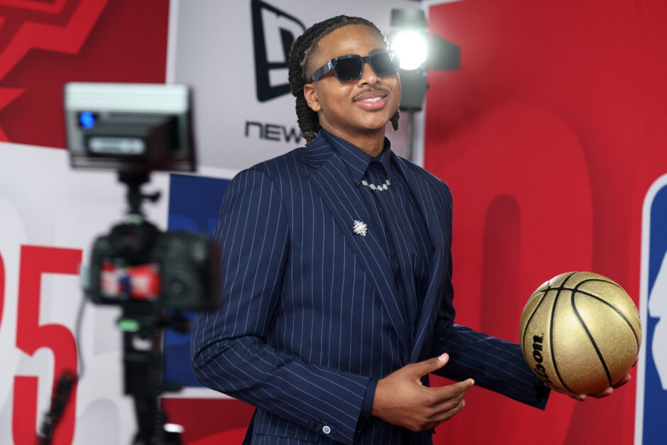 Collin Murray-Boyles wears sunglasses and holds gold basketball at NBA Draft