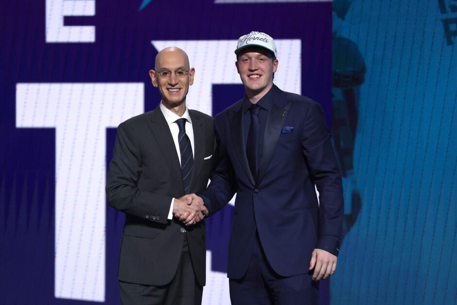 Kon Knueppel shakes hands with Adam Silver after being selected by the Charlotte Hornets at the 2025 NBA Draft
