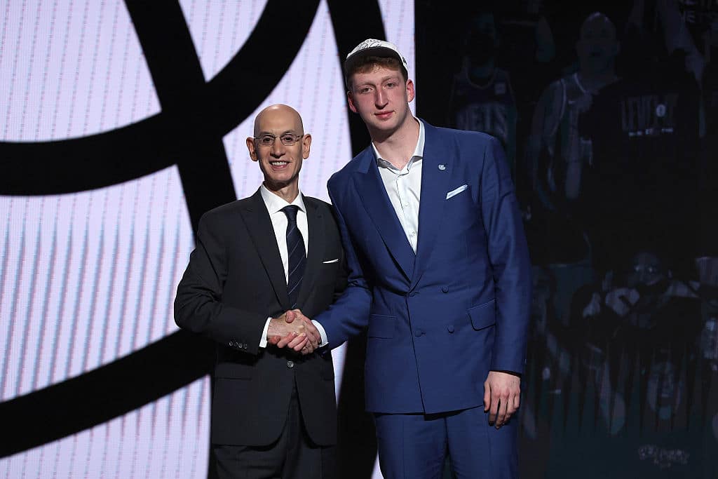NEW YORK, NEW YORK - JUNE 25: Danny Wolf (R) shakes hands with NBA commissioner Adam Silver (L) after being drafted twenty-seventh overall by the Brooklyn Nets during the first round of the 2025 NBA Draft at Barclays Center on June 25, 2025 in the Brooklyn borough of New York City. NOTE TO USER: User expressly acknowledges and agrees that, by downloading and/or using this photograph, user is consenting to the terms and conditions of the Getty Images License Agreement. (Photo by Sarah Stier/Getty Images)