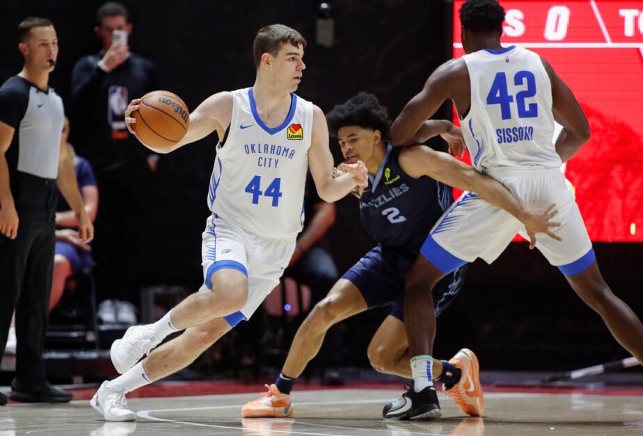 Nikola Topic #44 of Oklahoma City Thunder drives around Zyon Pullin #2 of the Memphis Grizzlies during the first half of their NBA Summer League game.