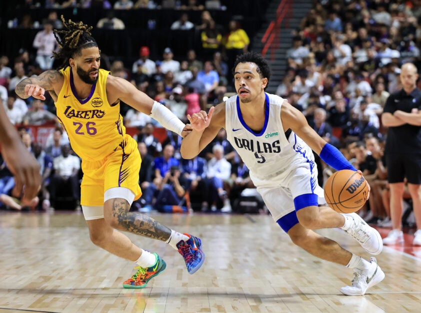 Ryan Nembhard dribbles the ball against the Lakers at Summer League