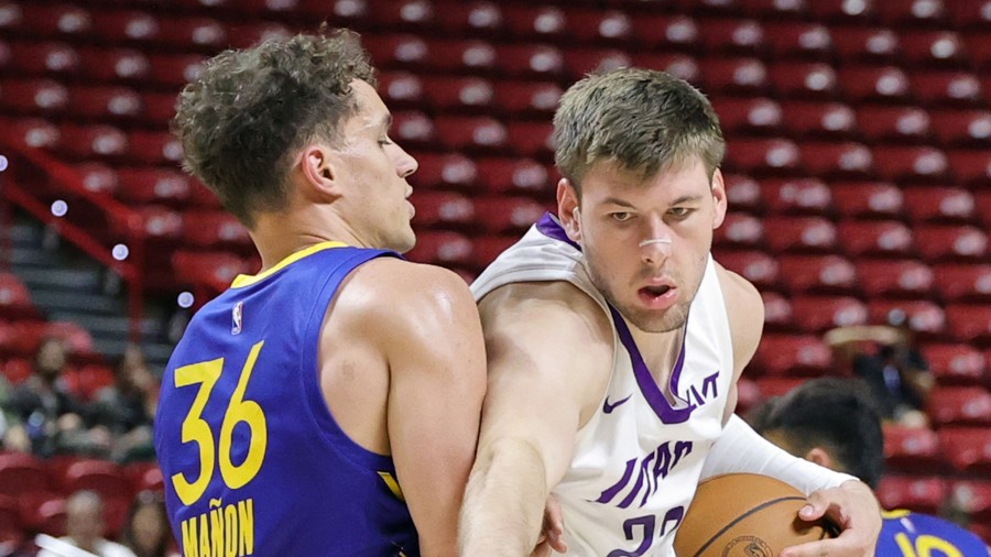 Kyle Filipowski #22 of the Utah Jazz drives to the basket against Chris Manon #36 of the Golden Sta...