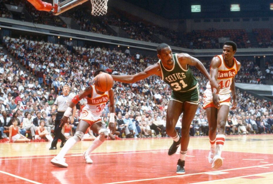 Boston Celtics legend Cedric Maxwell controls the ball