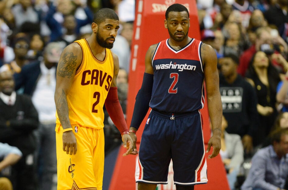 John Wall #2 of the Washington Wizards and Kyrie Irving #2 of the Cleveland Cavaliers wait for the ball to be thrown in during the game.