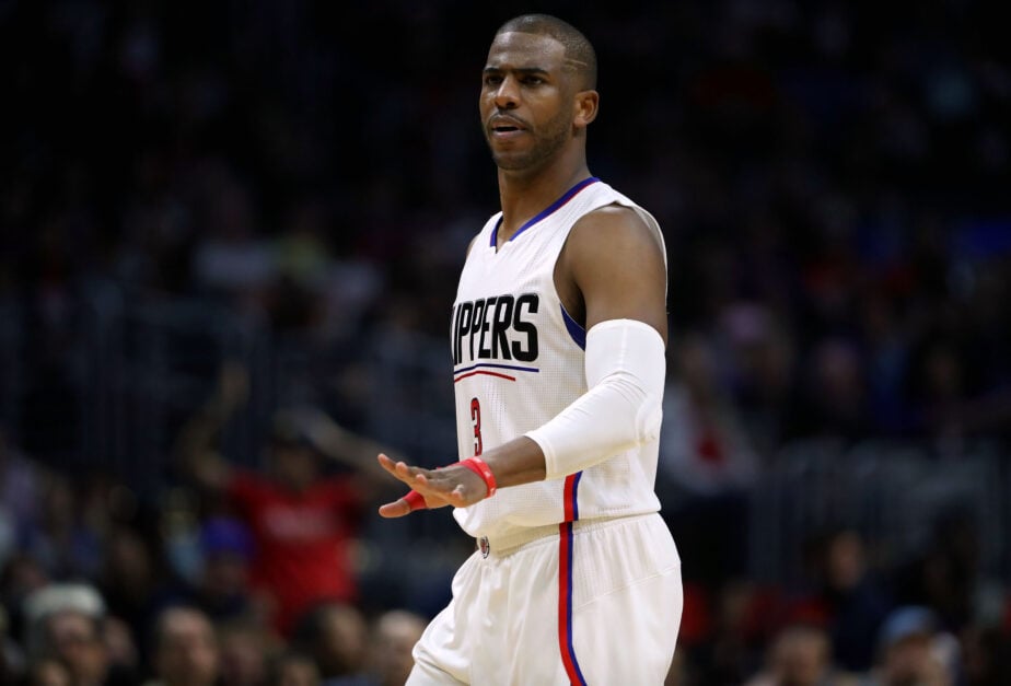 Chris Paul of the Los Angeles Clippers gestures to a teammate during the NBA game against the Milwaukee Bucks