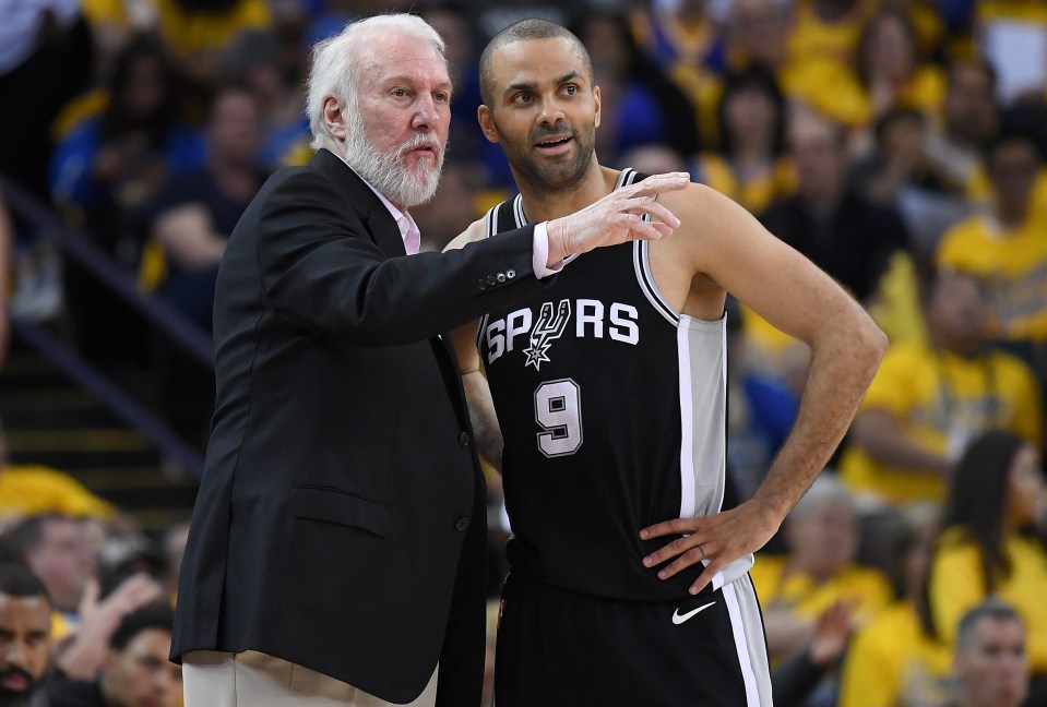 OAKLAND, CA - APRIL 14:  Head coach Gregg Popovich of the San Antonio Spurs talks with his player Tony Parker #9 against the Golden State Warriors in the second quarter during Game One of the first round of the 2018 NBA Playoff at ORACLE Arena on April 14, 2018 in Oakland, California. NOTE TO USER: User expressly acknowledges and agrees that, by downloading and or using this photograph, User is consenting to the terms and conditions of the Getty Images License Agreement.  (Photo by Thearon W. Henderson/Getty Images)