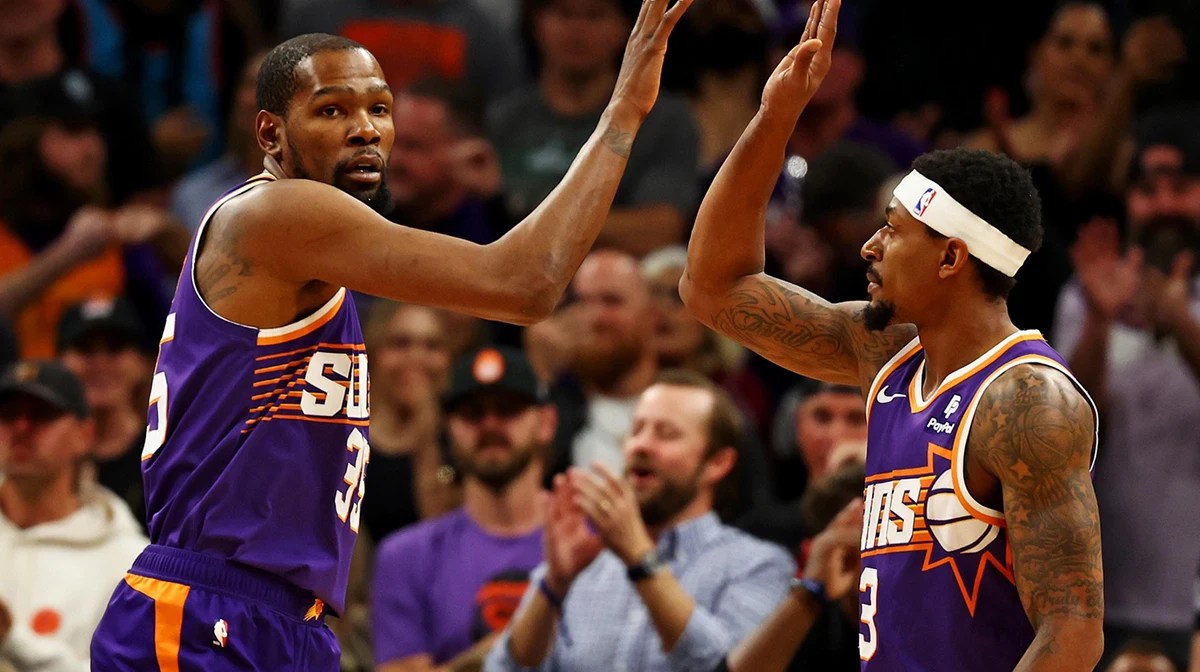 Phoenix Suns forward Kevin Durant (35) celebrates with guard Bradley Beal (3) during the first quarter of the game against the Oklahoma City Thunder at Footprint Center.