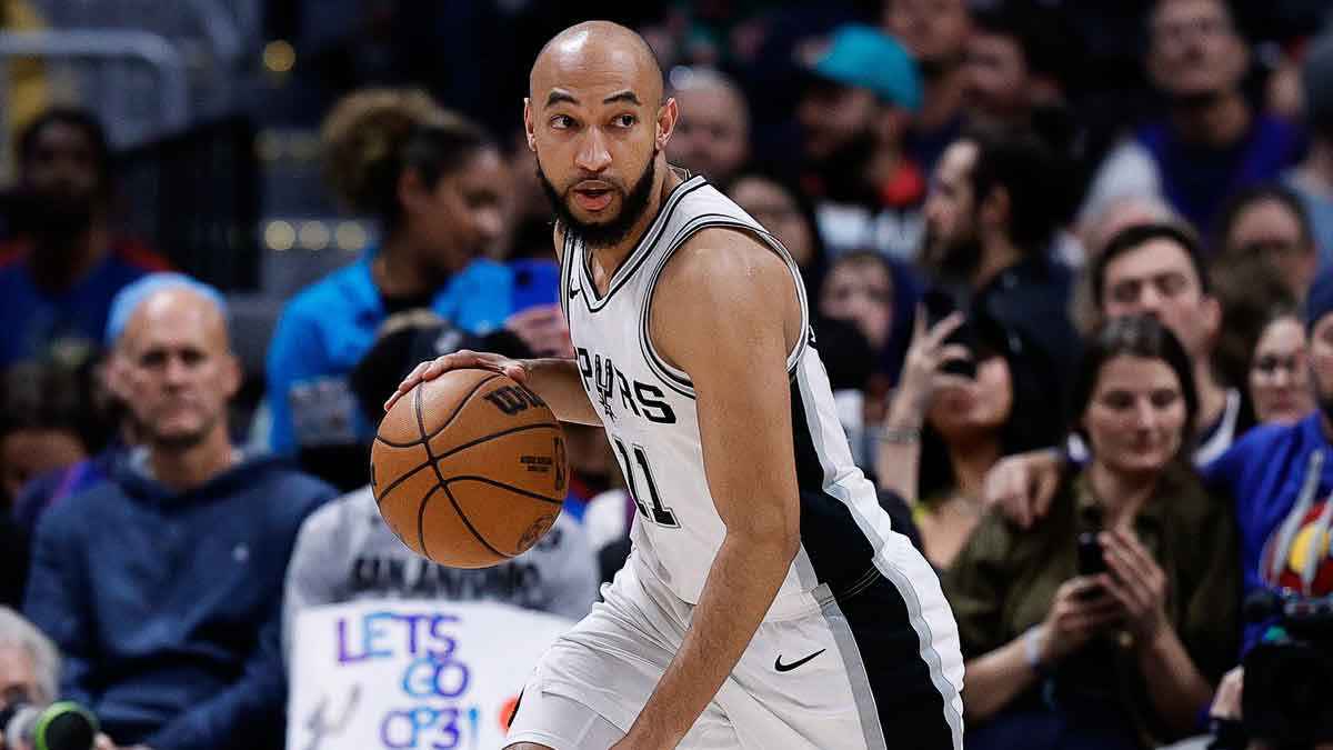 San Antonio Spurs guard Jordan McLaughlin (11) controls the ball in the third quarter against the Denver Nuggets at Ball Arena.