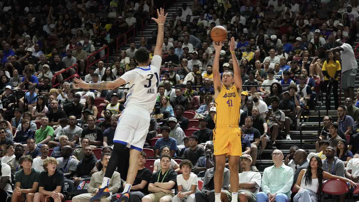 Los Angeles Lakers forward Cole Swider (41) shoots a three point basket against Dallas Mavericks forward Jordan Hall (37) in the fourth quarter of their game at Thomas & Mack Center.