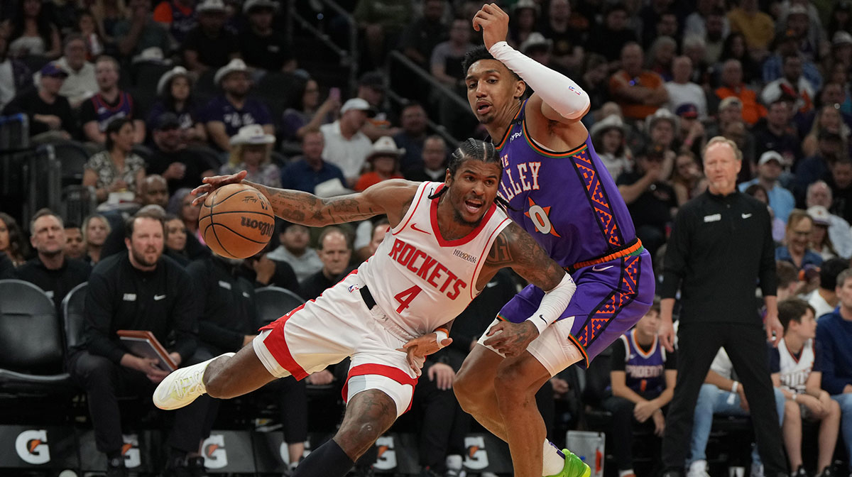 Houston Rockets guard Jalen Green (4) drives on Phoenix Suns forward Ryan Dunn (0) in the first half at Footprint Center.