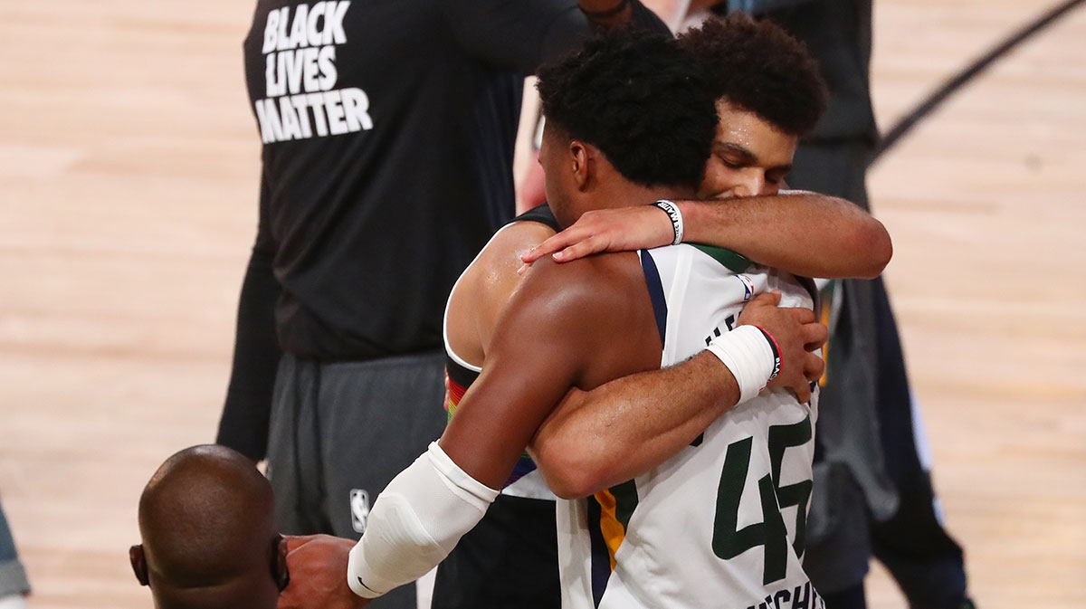Denver Nuggets guard Jamal Murray (27) and Utah Jazz guard Donovan Mitchell (45) embrace after a victory by the Nuggets in game seven of the first round of the 2020 NBA Playoffs at ESPN Wide World of Sports Complex.