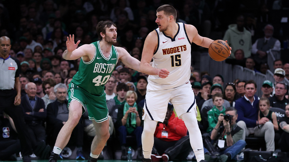 Denver Nuggets center Nikola Jokic (15) defended by Boston Celtics center Luke Kornet (40) during the second half at TD Garden.