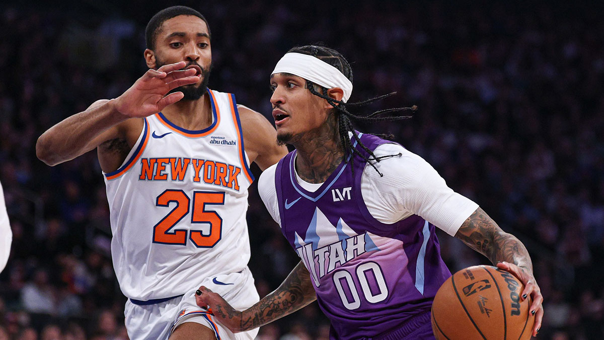 Jan 1, 2025; New York, New York, USA; Utah Jazz guard Jordan Clarkson (00) dribbles as New York Knicks forward Mikal Bridges (25) defends during the first half at Madison Square Garden. Mandatory Credit: Vincent Carchietta-Imagn Images