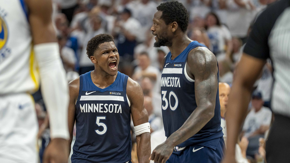 Minnesota Timberwolves guard Anthony Edwards (5) celebrates with Minnesota Timberwolves forward Julius Randle (30) after making a shot against the Golden State Warriors in the first half during game five of the second round for the 2025 NBA Playoffs at Target Center.