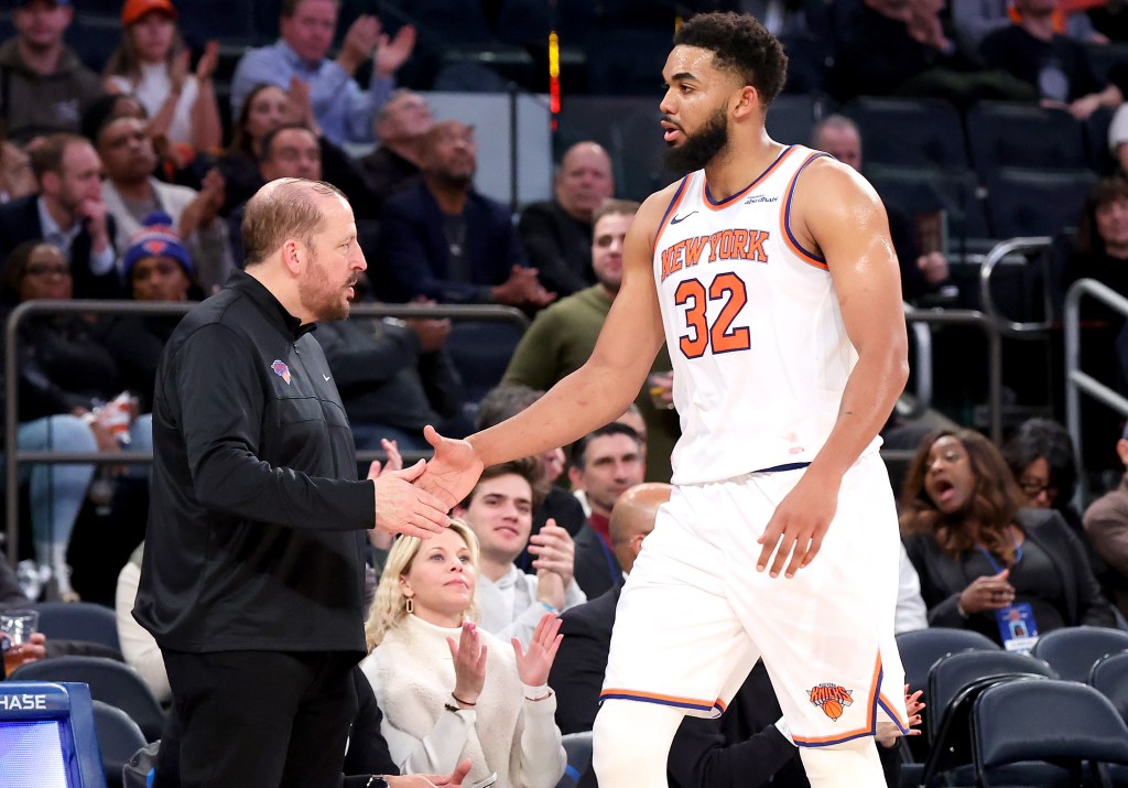 Karl-Anthony Towns slaps hands with Tom Thibodeau as he returns to the bench during a Knicks game earlier this season.
