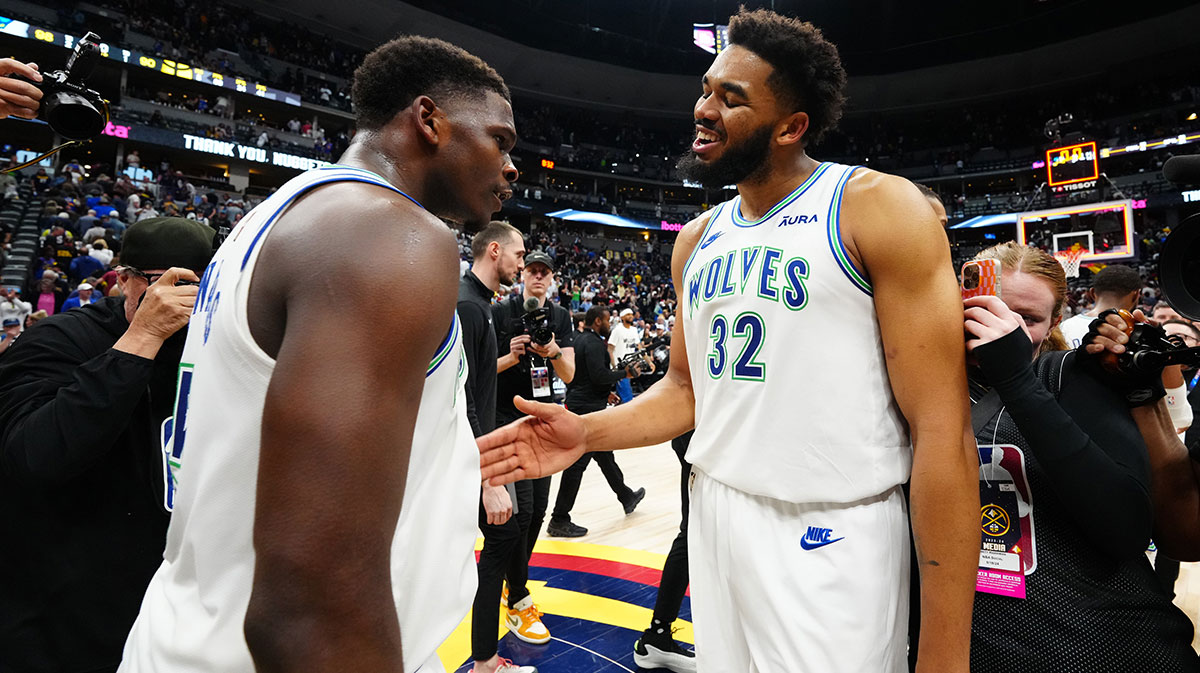 Minnesota Timberwolves guard Anthony Edwards (5) and center Karl-Anthony Towns (32) celebrate defeating the against the Denver Nuggets in game seven of the second round for the 2024 NBA playoffs at Ball Arena.