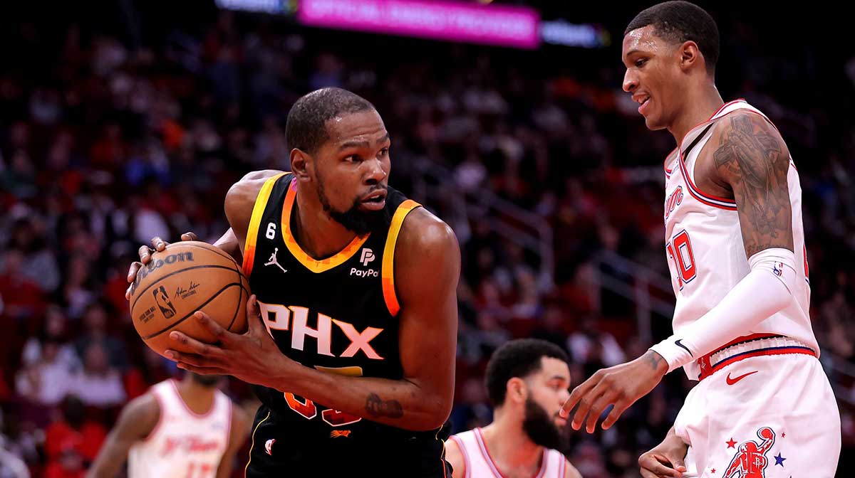 Phoenix Suns forward Kevin Durant (35) rebounds against Houston Rockets forward Jabari Smith Jr. (10) during the first quarter at Toyota Center.