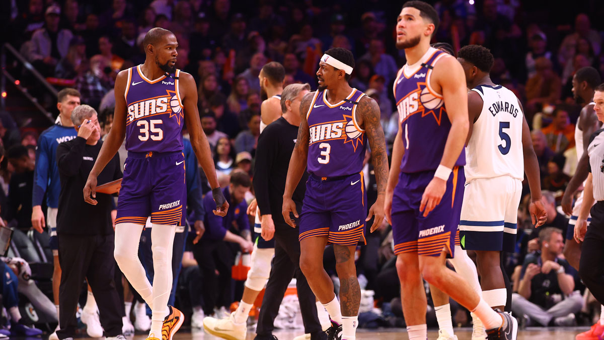 Phoenix Suns forward Kevin Durant (35) with guard Bradley Beal (3) and Devin Booker (1) against the Minnesota Timberwolves at Footprint Center. 
