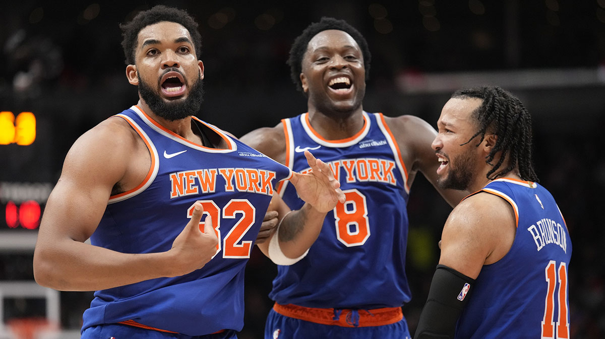 New York Knicks guard Jalen Brunson (11) and forward OG Anunoby (8) react after a three point basket by center Karl-Anthony Towns (32) to clinch a win over the Toronto Raptors during the second half at Scotiabank Arena.